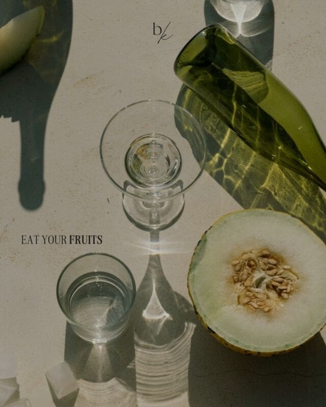 aesthetic flat lay with water and honeydew